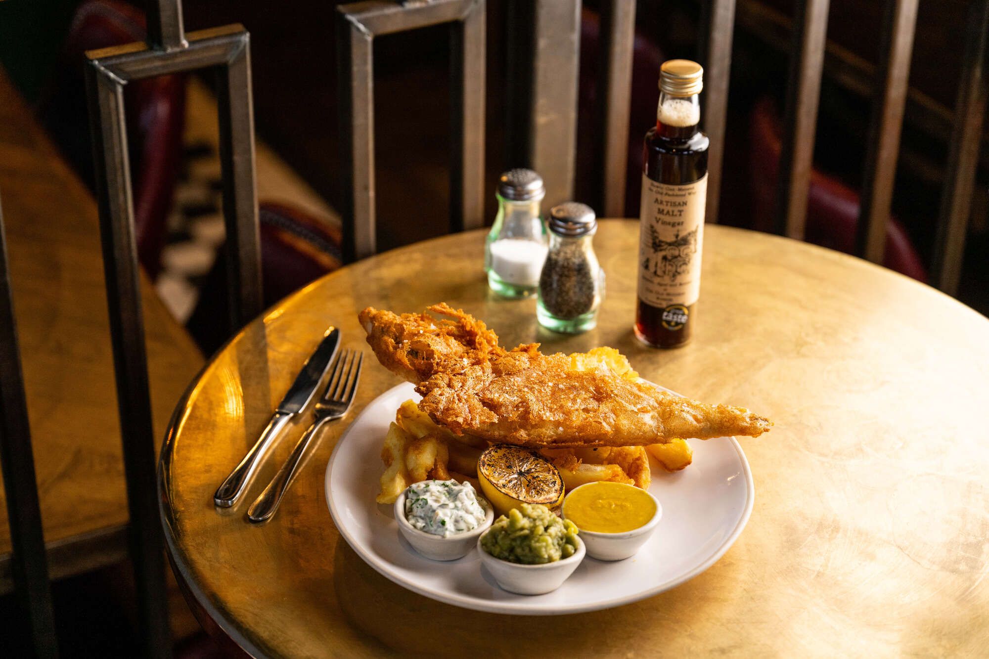Beer-battered fish with chips, peas and tartare sauce